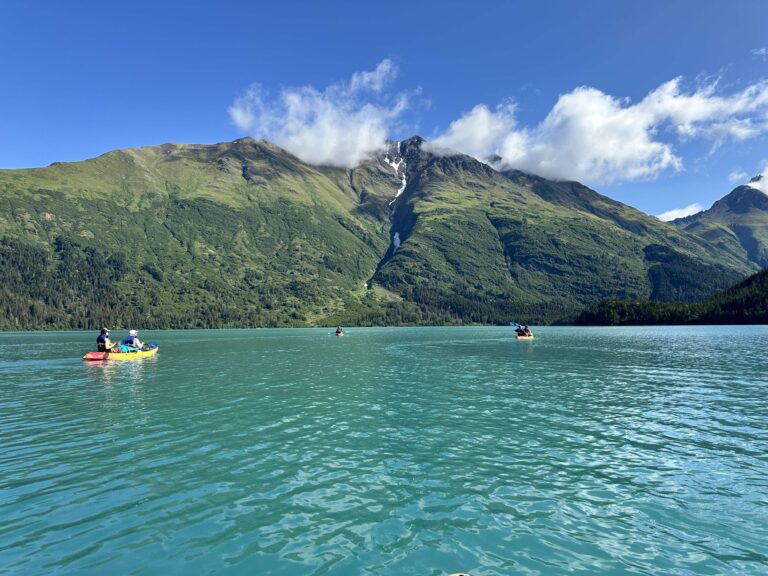 Kayaks on Emerald Water of Grant Lake in front of Lark Mountain